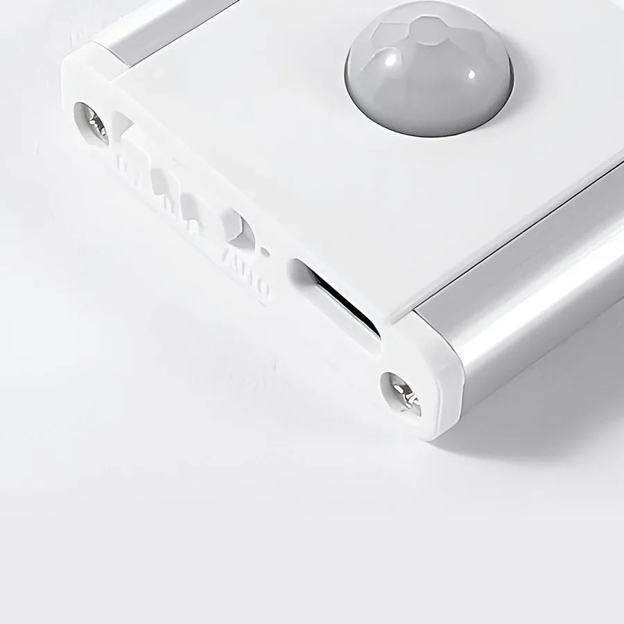 Ultra-slim motion sensor cabinet light in sleek aluminum, black or silver, 9mm thick, 20-60cm, versatile, hands-free.