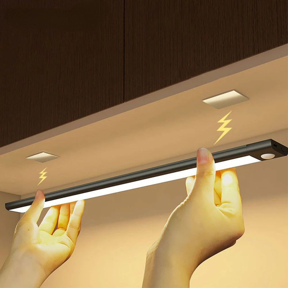 Ultra-slim motion sensor cabinet light in sleek aluminum, black or silver, 9mm thick, 20-60cm, versatile, hands-free.