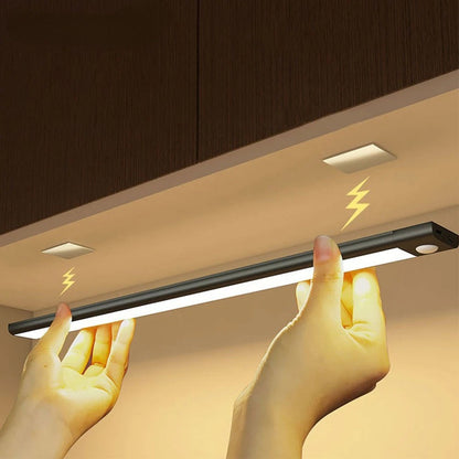 Ultra-slim motion sensor cabinet light in sleek aluminum, black or silver, 9mm thick, 20-60cm, versatile, hands-free.