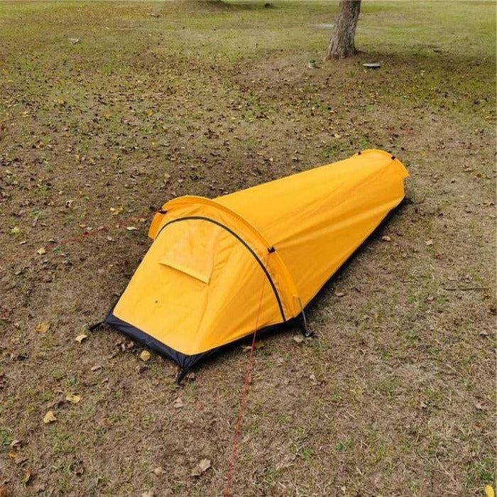 "Ultralight camping tent for solo use, durable and weather-resistant, featuring mesh ventilation and a reinforced base."