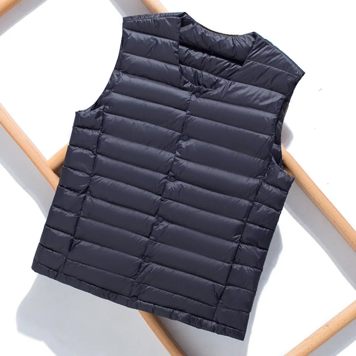 Versatile men's down vest, an ultralight sleeveless jacket for casual or outdoor apparel.