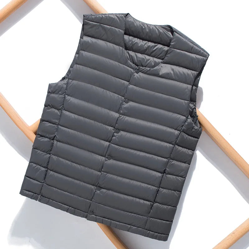 Durable men's ultralight down vest, perfect for travel, hiking, or as a cozy casual layering piece.