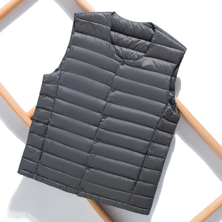 Durable men's ultralight down vest, perfect for travel, hiking, or as a cozy casual layering piece.