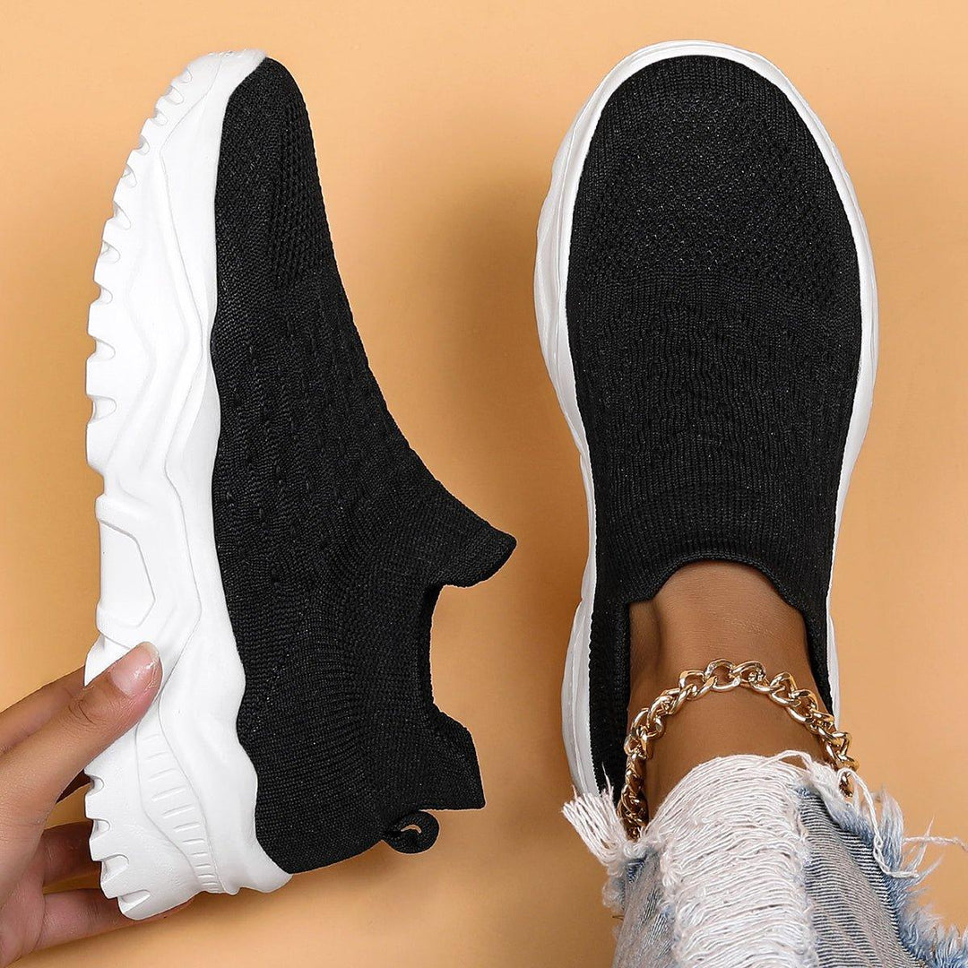 Unisex black & white orthopedic slip-on shoes, offering comfort and support for everyday wear