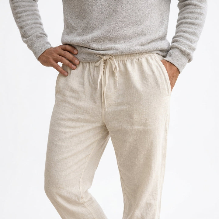 Breathable unisex linen pants with a drawstring waist, providing lightweight comfort for summer or casual wear.