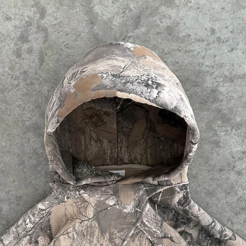 "Unisex camo streetwear hoodie with tactical print, front view. Urban and outdoor style, men's jackets and coats collection."