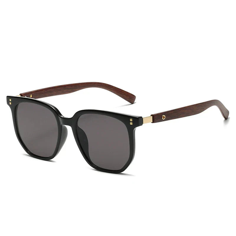 Close-up of classic angular unisex sunglasses, black frame, UV400 lens, protective eyewear