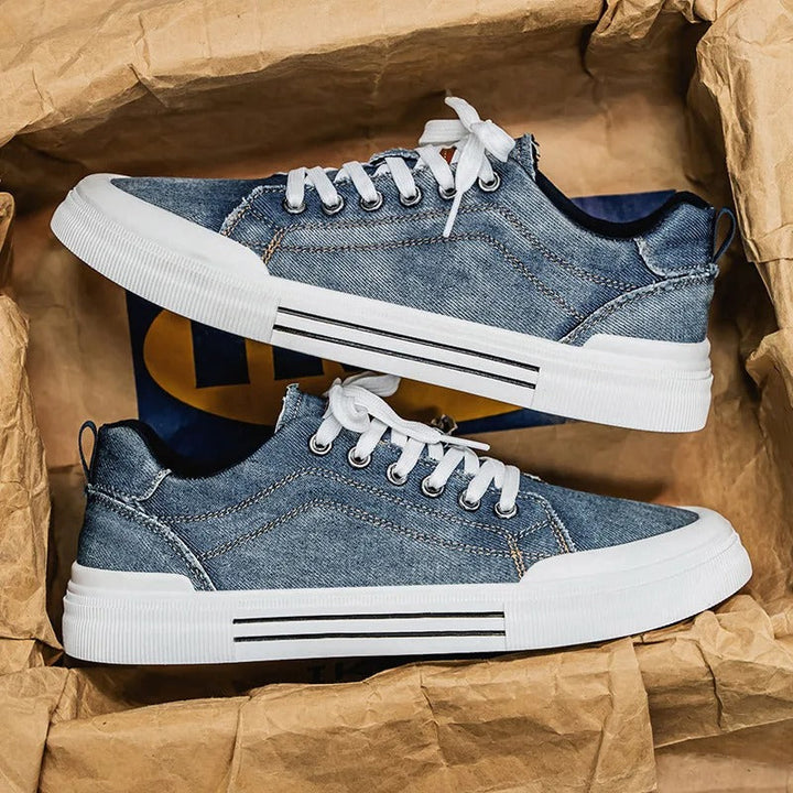 Unisex low-top canvas sneakers in denim, offering a stylish and comfortable option for casual outfits.