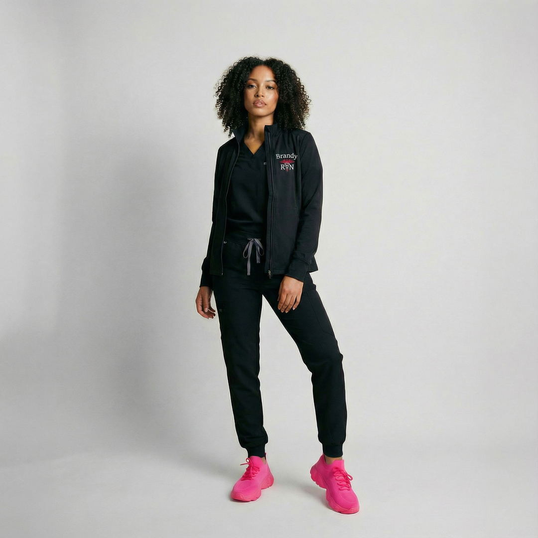 Midweight unisex quarter zip jacket made from soft, recycled stretch fleece with zippered pockets