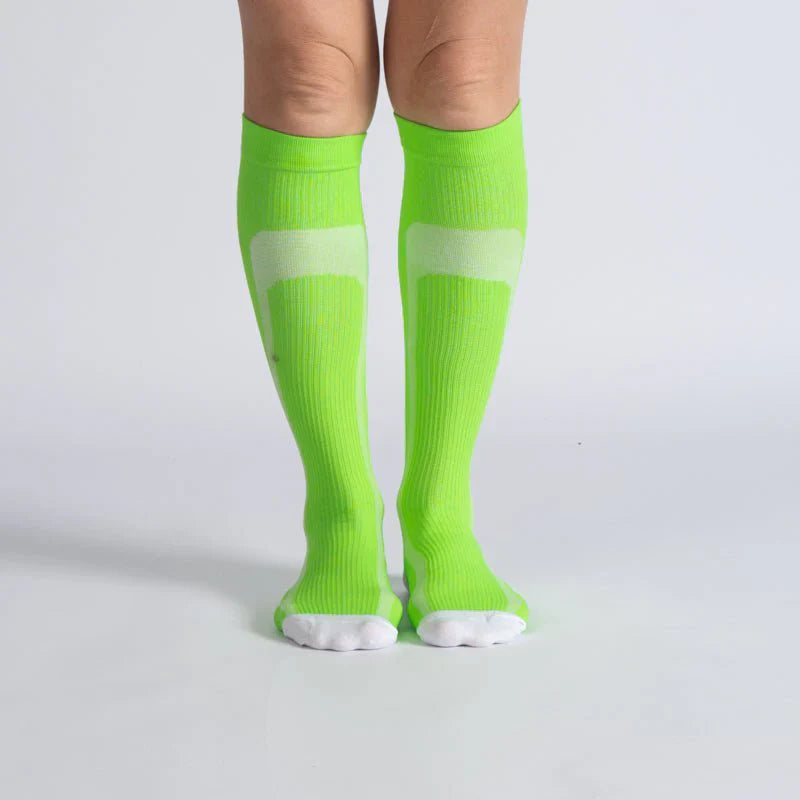 Unisex gentle compression socks in a vibrant green and white stripe pattern, promoting leg support and comfort.