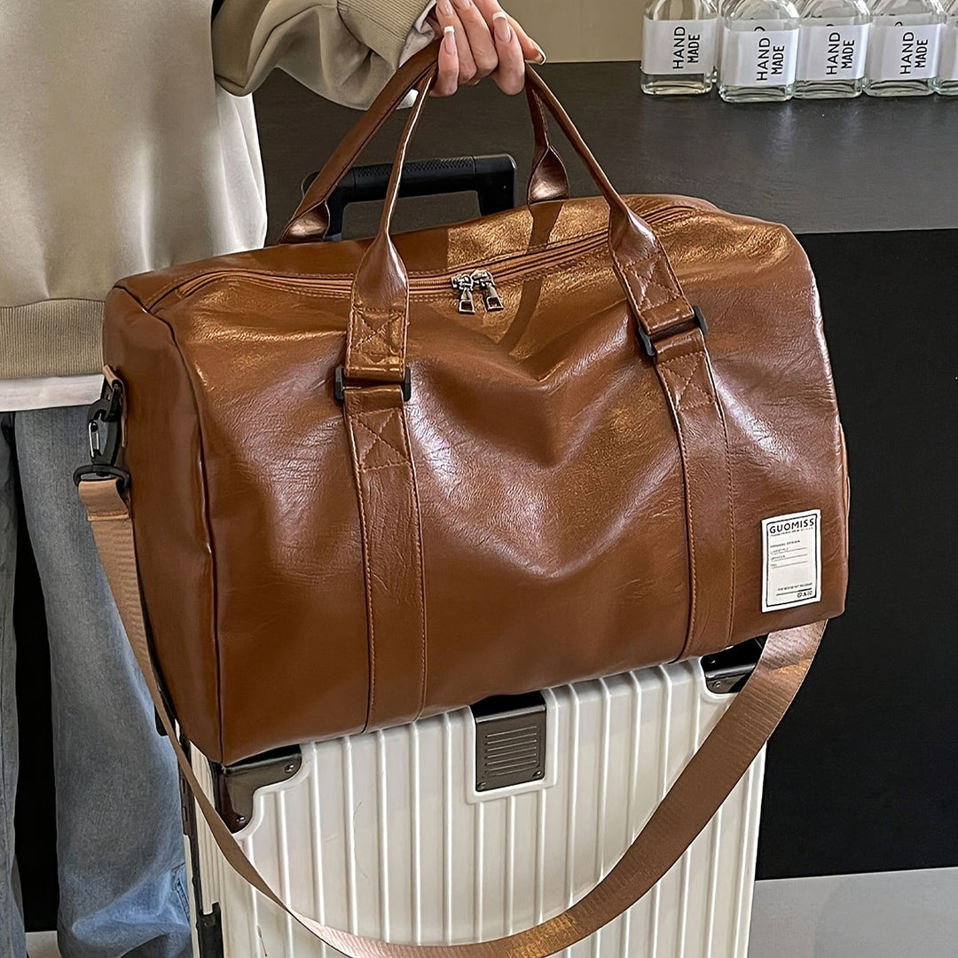 Stylish genuine leather travel duffle bag, a unisex overnight bag with classic design, front view