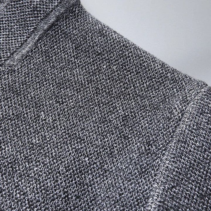 Black unisex wool cardigan sweater, providing warmth and minimalist style for casual wear.