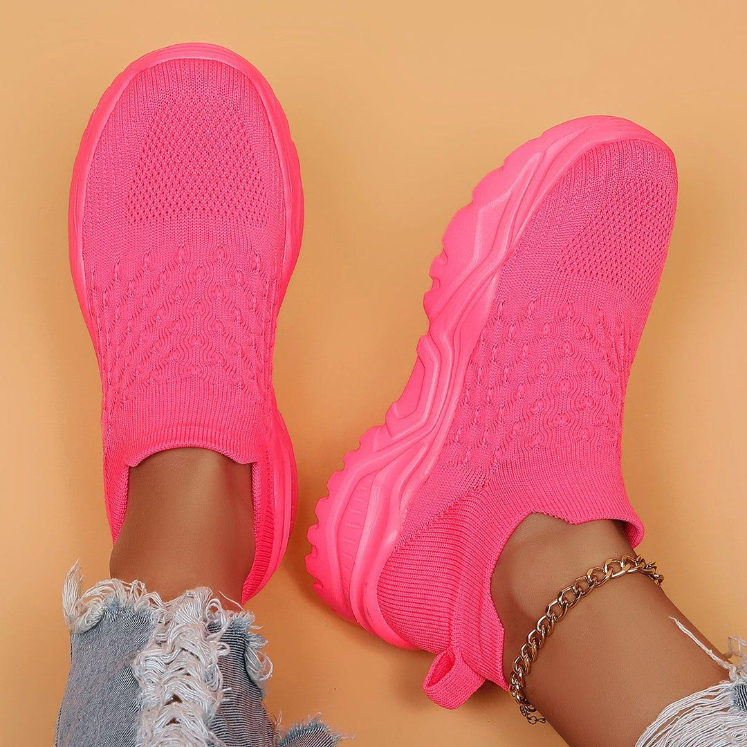 Barbie Pink Ortho Cloud slip-on shoes on a white background, highlighting vibrant color