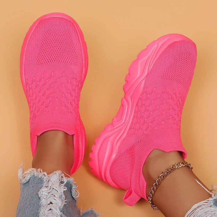 Barbie Pink Ortho Cloud slip-on shoes on a white background, highlighting vibrant color