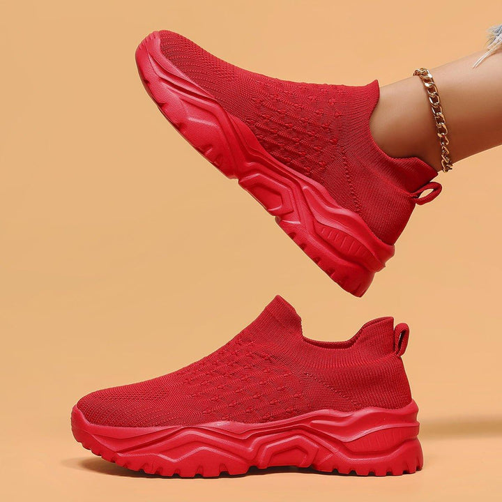 Model wearing Red Rose Orthopedic Cloud Slip-On Shoes, demonstrating casual and active look