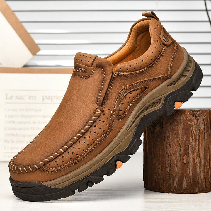 Close-up of the stitching details on a brown Unisex Orthopedic Transition Boot, quality craftsmanship.