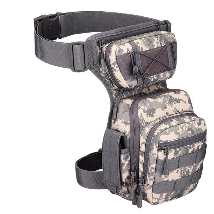 Detail of the quick-release buckle on the thigh strap of an outdoor hiking bag, secure & adjustable