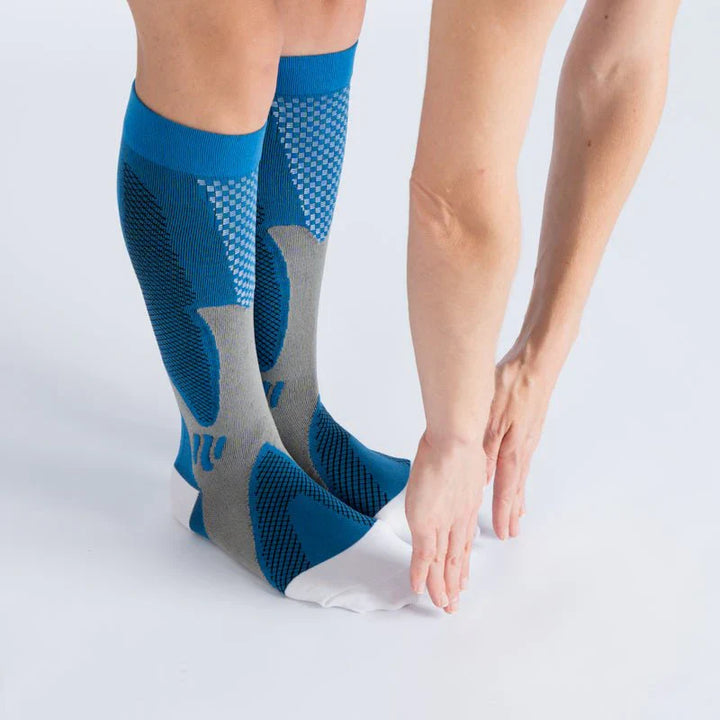 Close-up of royal blue unisex support socks (12-15mmHg) fabric, showing comfortable and durable weave