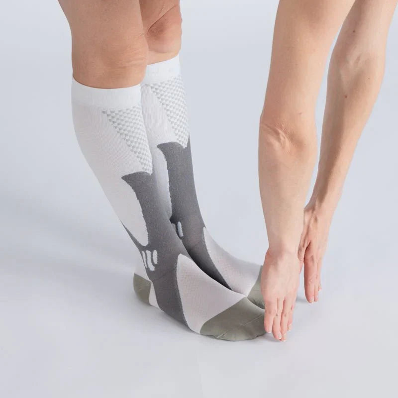 Pair of Royal White Gray compression socks, designed for consistent comfort and circulation support
