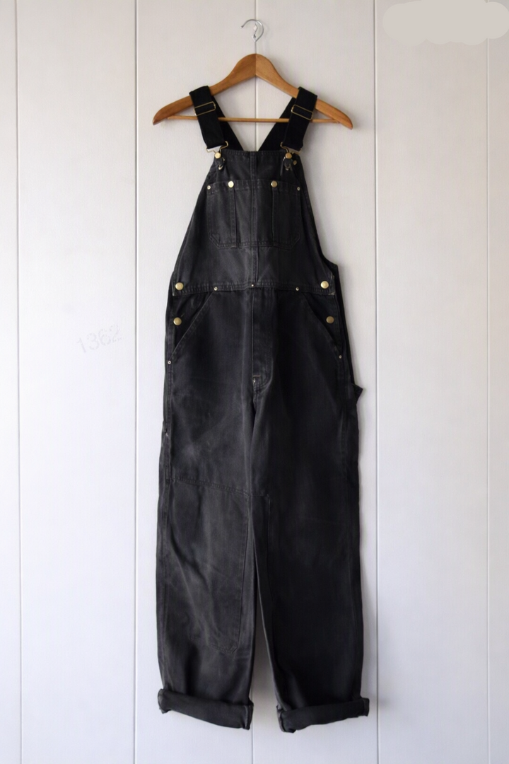 Workwear-inspired unisex bib overalls with vintage style, offering durable fabric, adjustable straps, and comfort.