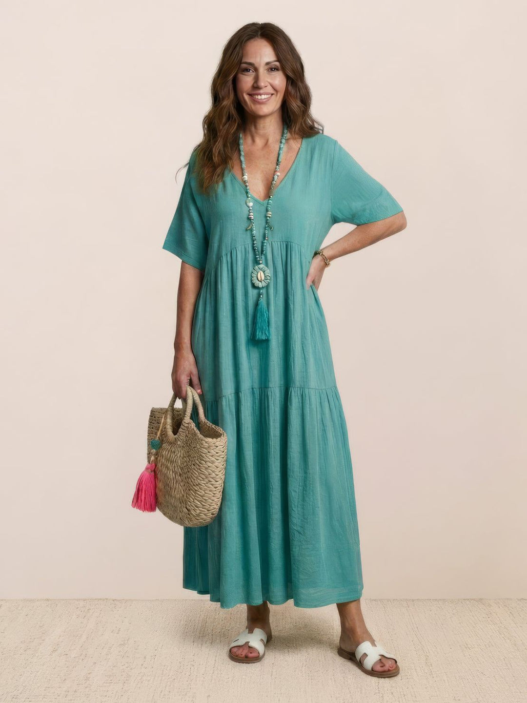 Elegant V-neck tiered maxi dress for women, a flowy bohemian gown for special days.