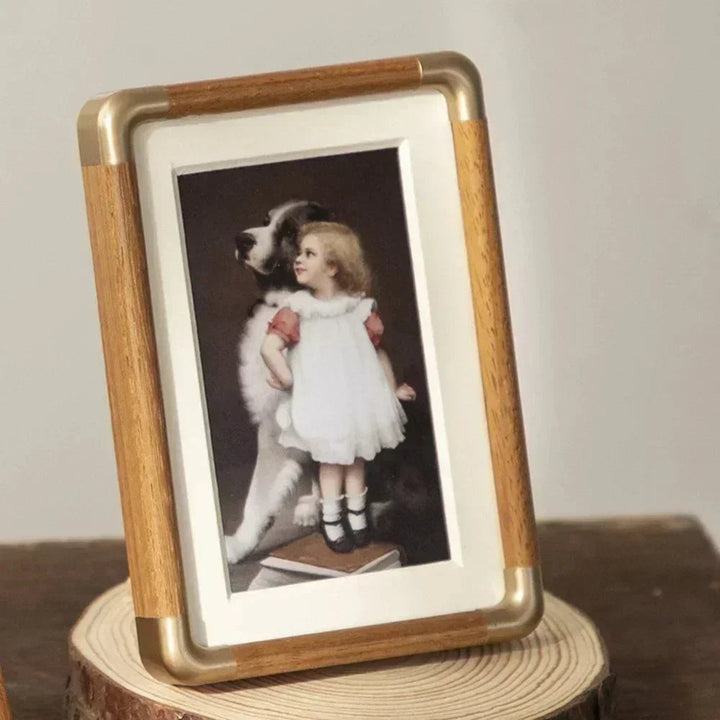 Clear double-sided acrylic photo frame with magnetic closure for easy picture changes. Great for desk decor.