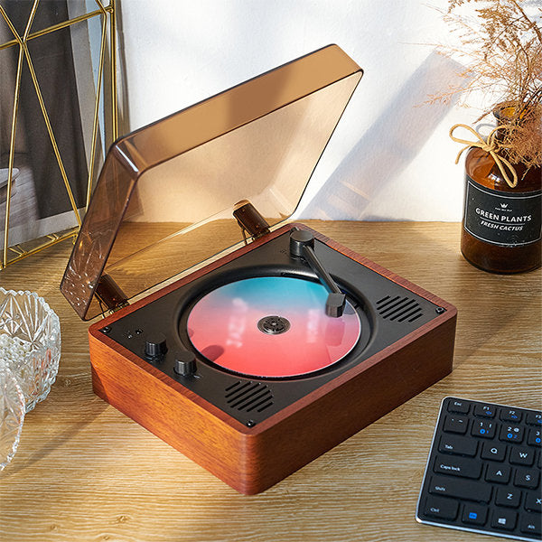 "Vintage-inspired CD player with chrome accents, analog knobs, and LCD display, blending nostalgic design with modern tech."