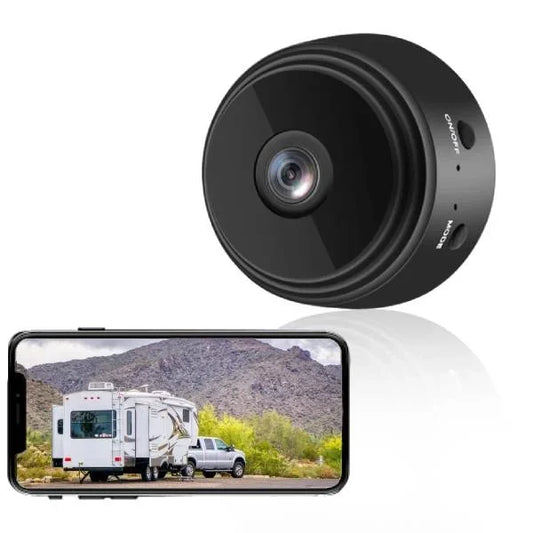 Waterproof wireless RV backup camera, 360° rotation, black with infrared LEDs, mounted on metal surface, enhancing safety.