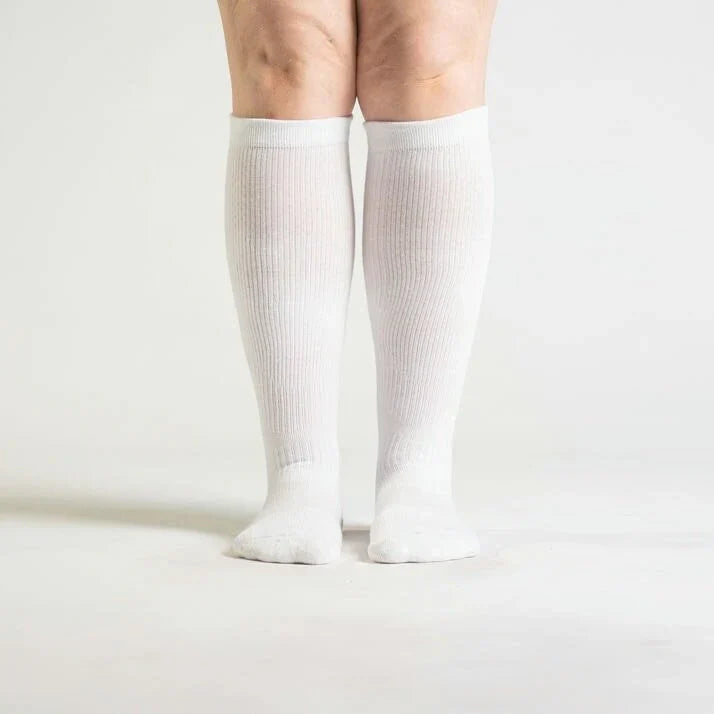 White unisex gentle compression socks for everyday wear, promoting circulatory health and comfort