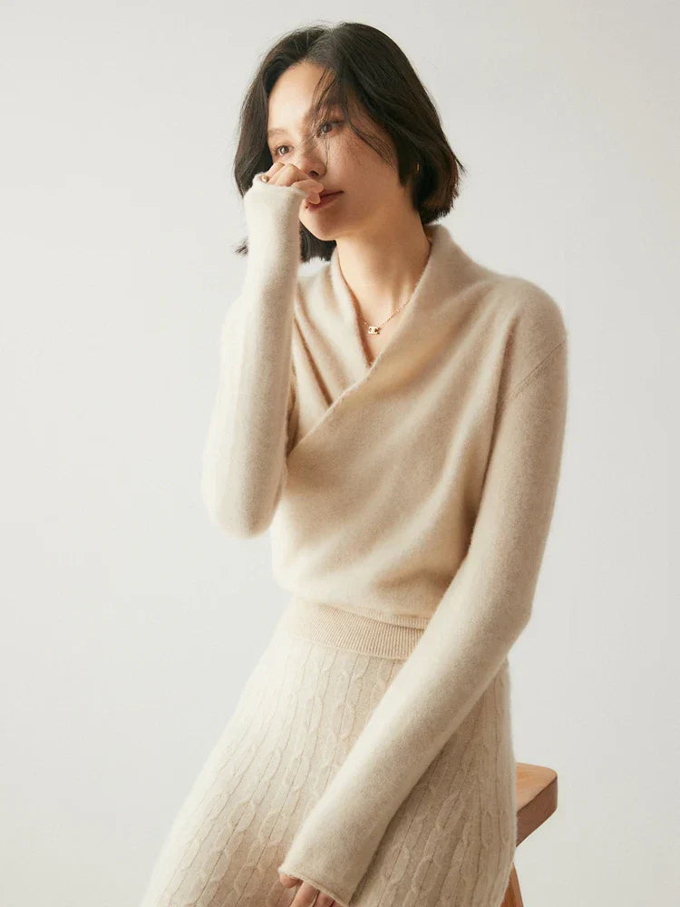 Back view of a woman in a pink cashmere crossover sweater, chic knitwear