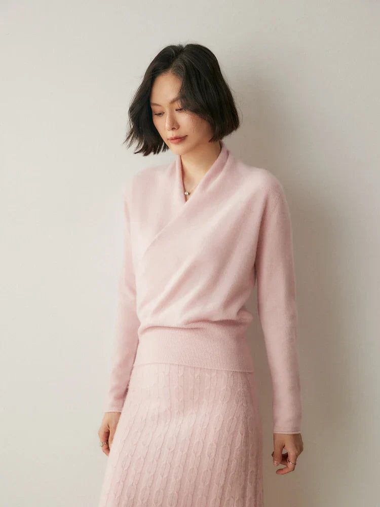 Detail of the knit pattern on a pink cashmere crossover sweater