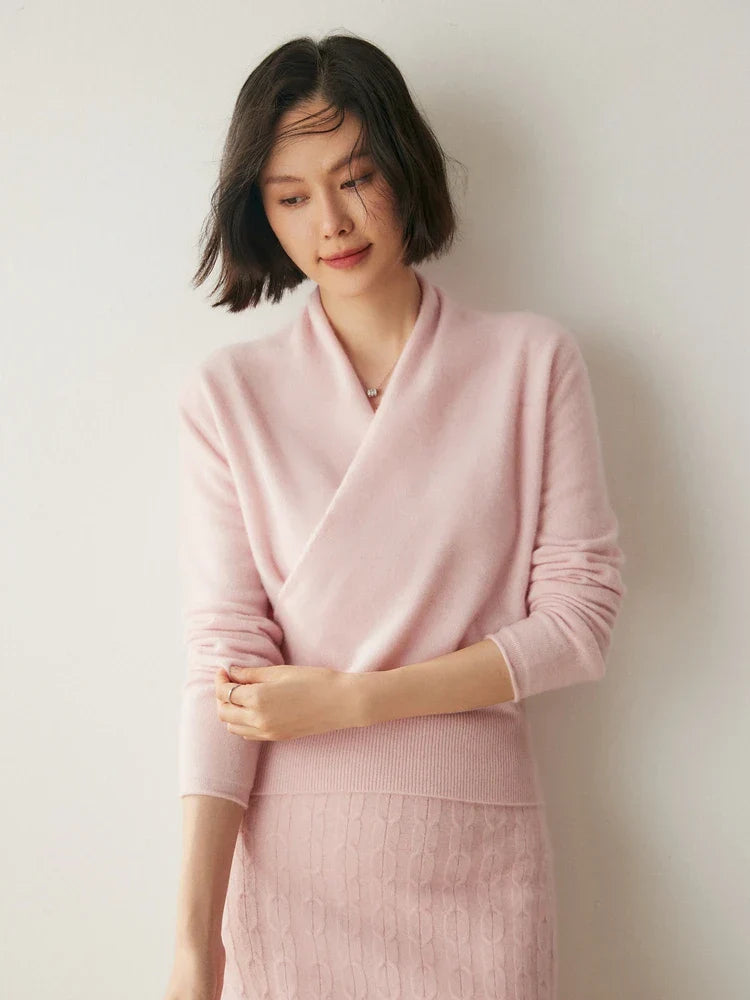Full shot of a luxurious pink women's cashmere crossover sweater