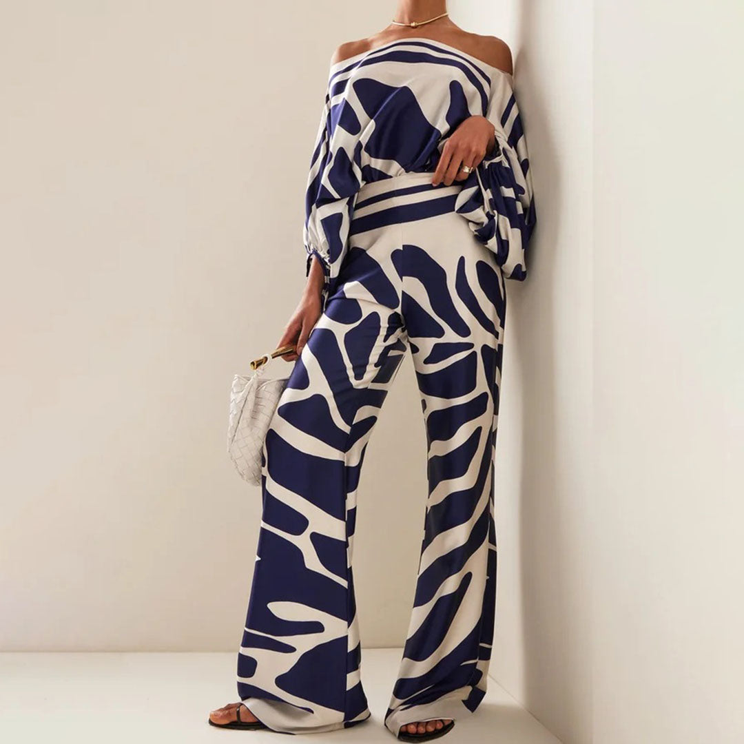 Abstract printed one-shoulder women's set, featuring a stylish top and wide-leg pants for a fashion statement.