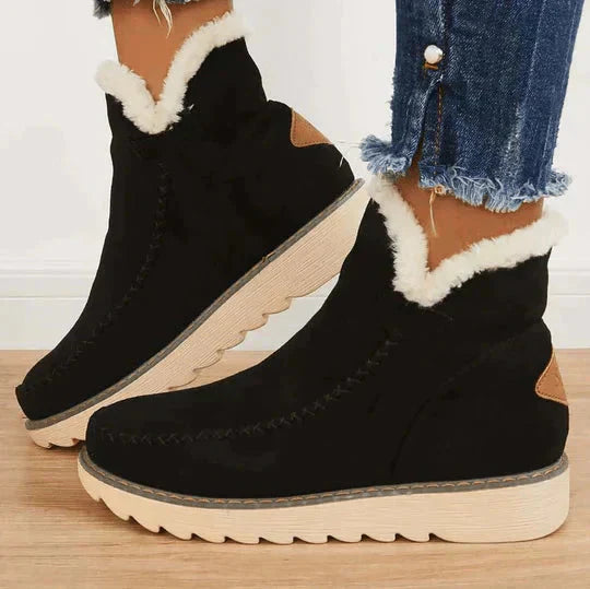 Women's black fleece-lined platform ankle boots with slip-on design, perfect winter casual footwear