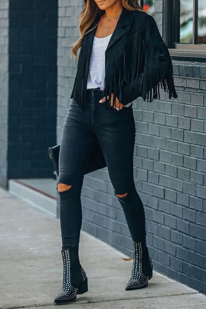 Black women's moto jacket with fringe detailing, ideal for an edgy casual or biker-inspired look.