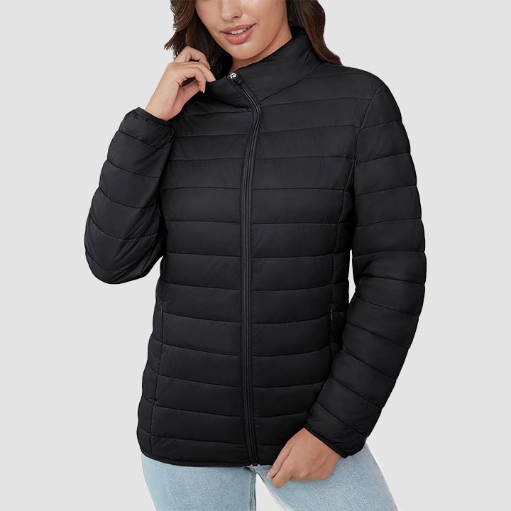 Women's lightweight quilted puffer jacket, unzipped, revealing a layered look. Versatile spring outerwear.