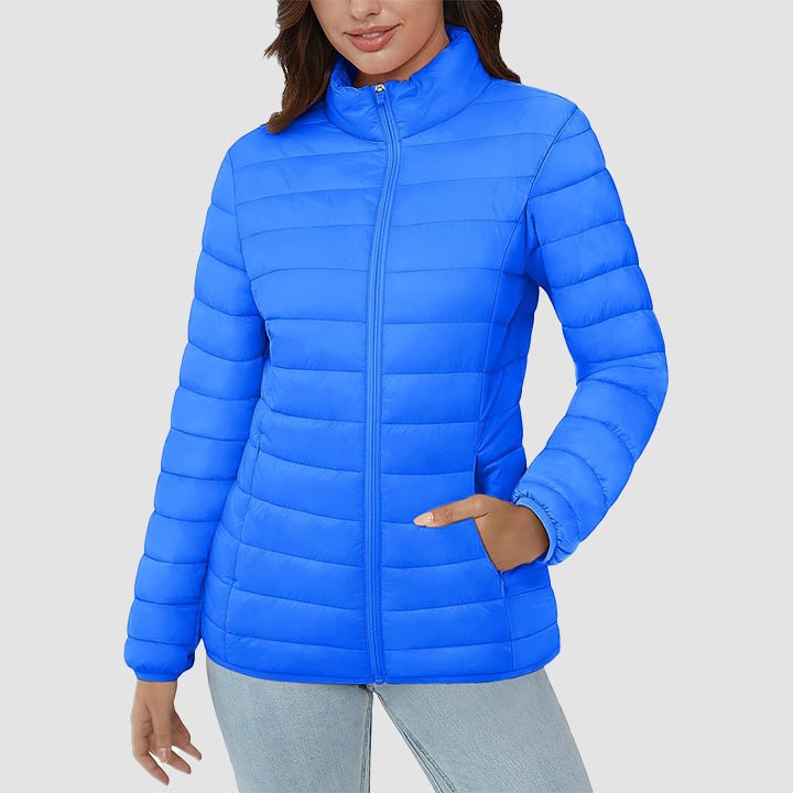 Fashionable woman posing in a lightweight quilted puffer jacket, showcasing its modern fall style.