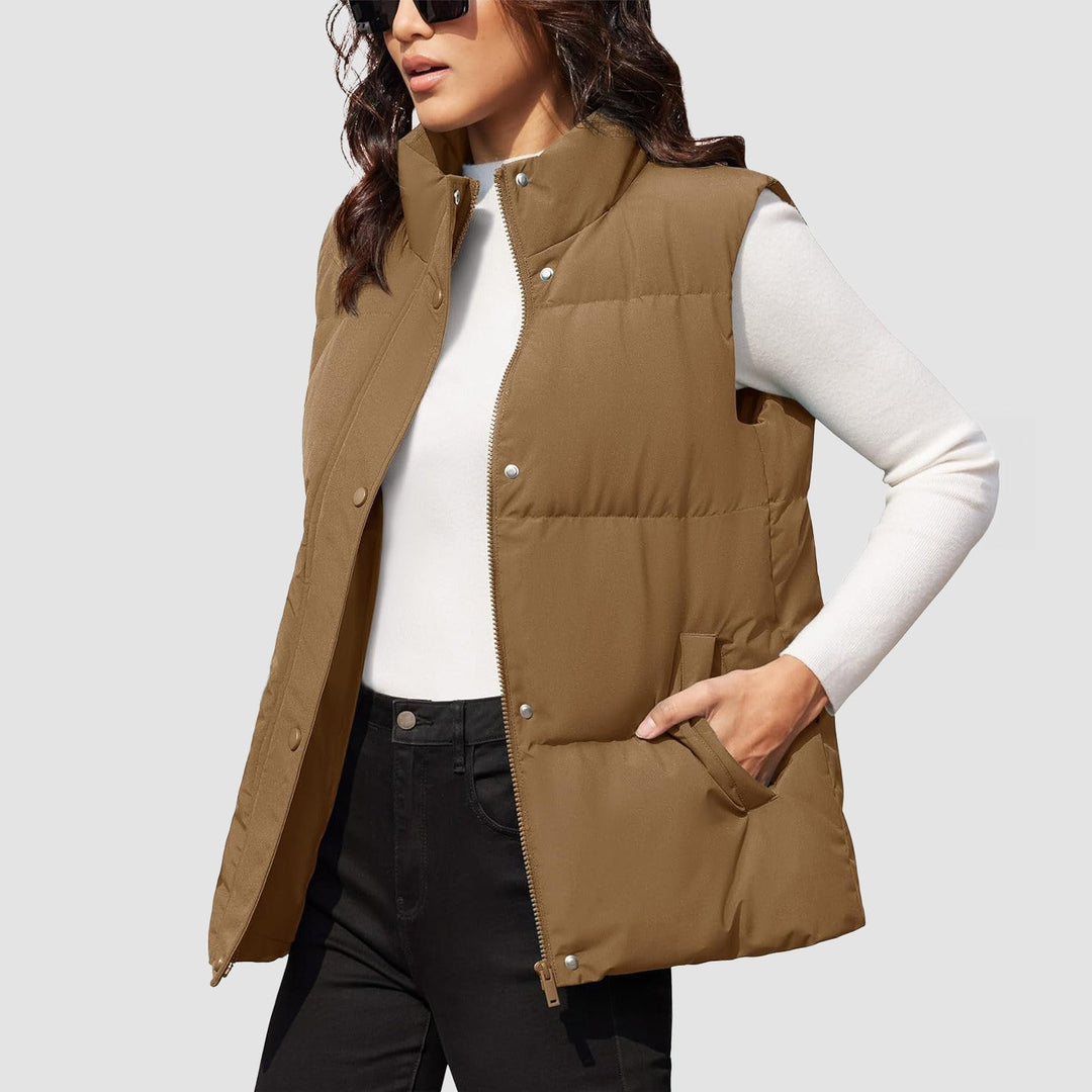 Three-quarter view of a women's black quilted puffer vest, excellent for fall fashion layering