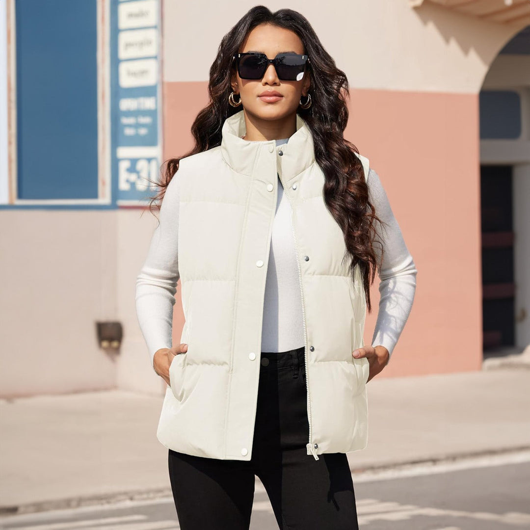 Women's quilted puffer vest in a soft pink, lightweight, a fashionable winter apparel piece