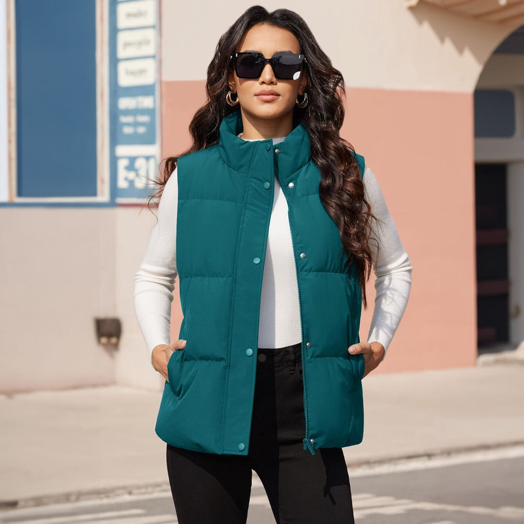 Women's black quilted puffer vest, styled for an active look, great for casual vest activities