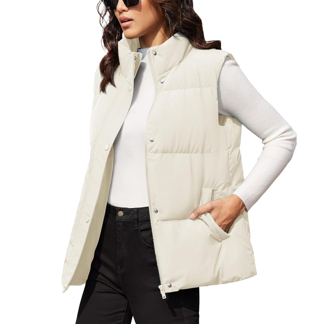 Stylish women's navy quilted puffer vest, sleeveless, ideal for winter apparel layering