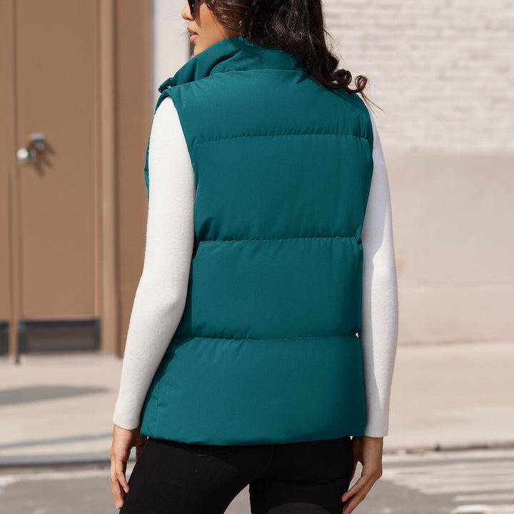 Image of a women's lightweight quilted puffer vest in a classic white, versatile fall fashion