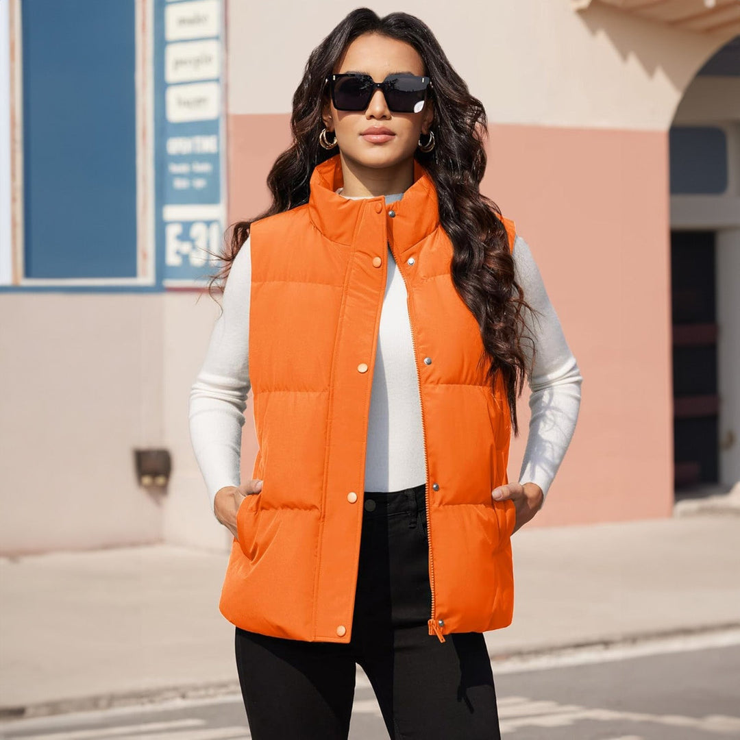 Women's black quilted puffer vest, shown hanging, ready to be worn for any casual occasion
