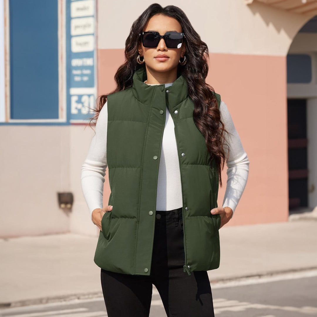 Women's lightweight quilted puffer vest, navy, folded neatly, ready for travel, fall fashion