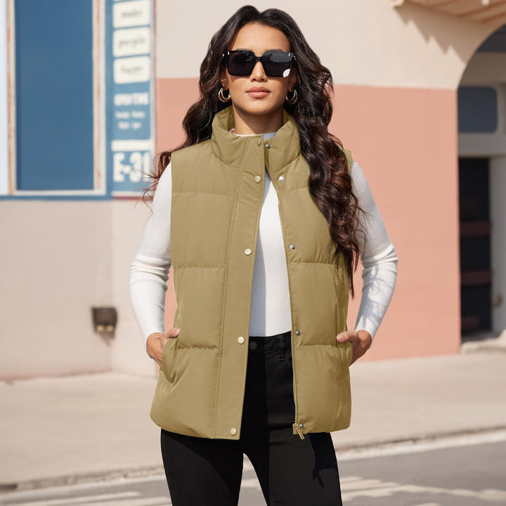 Women's lightweight quilted puffer vest, navy, paired with a scarf, autumn fashion layering