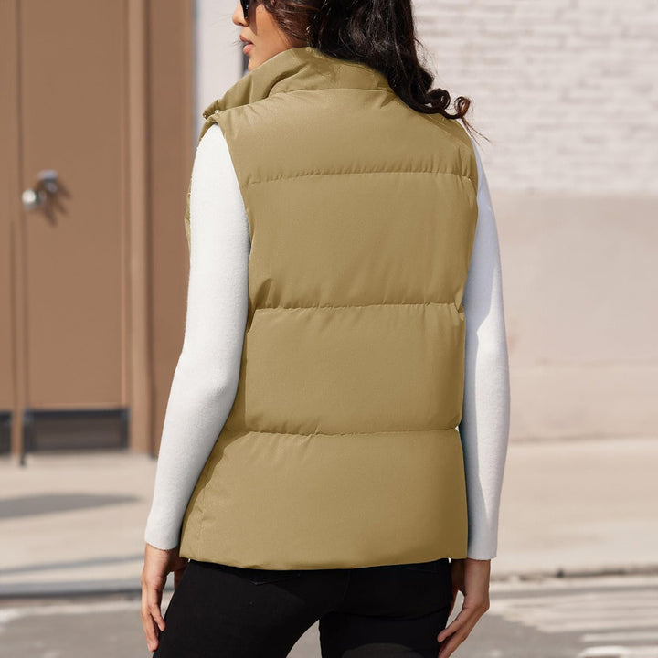 Women's quilted puffer vest, black, with an adjustable hem cord, versatile outerwear