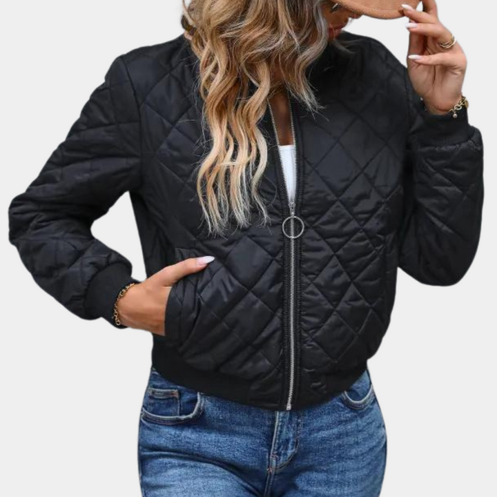 Women's black quilted zip-up bomber jacket, a stylish and lightweight outerwear piece for fall fashion.