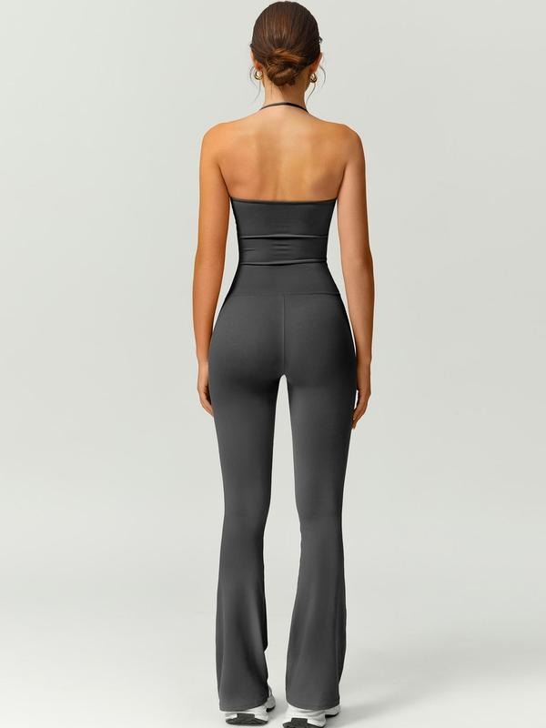 Full-body rear view of women's black sculpting flare jumpsuit, showing fit and adjustable straps