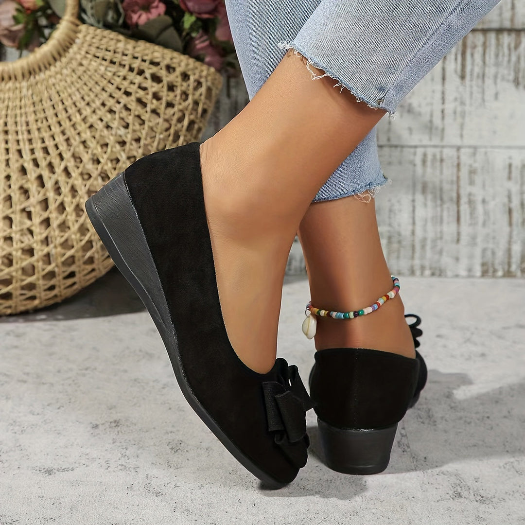 Everyday comfort: women's slip-on flats, modest wedge, and feminine bow.