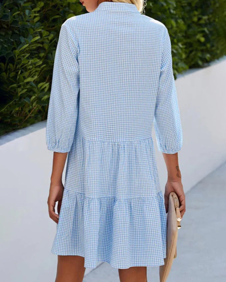 Chic women's casual short sleeve blue plaid dress. A comfortable tiered summer dress.